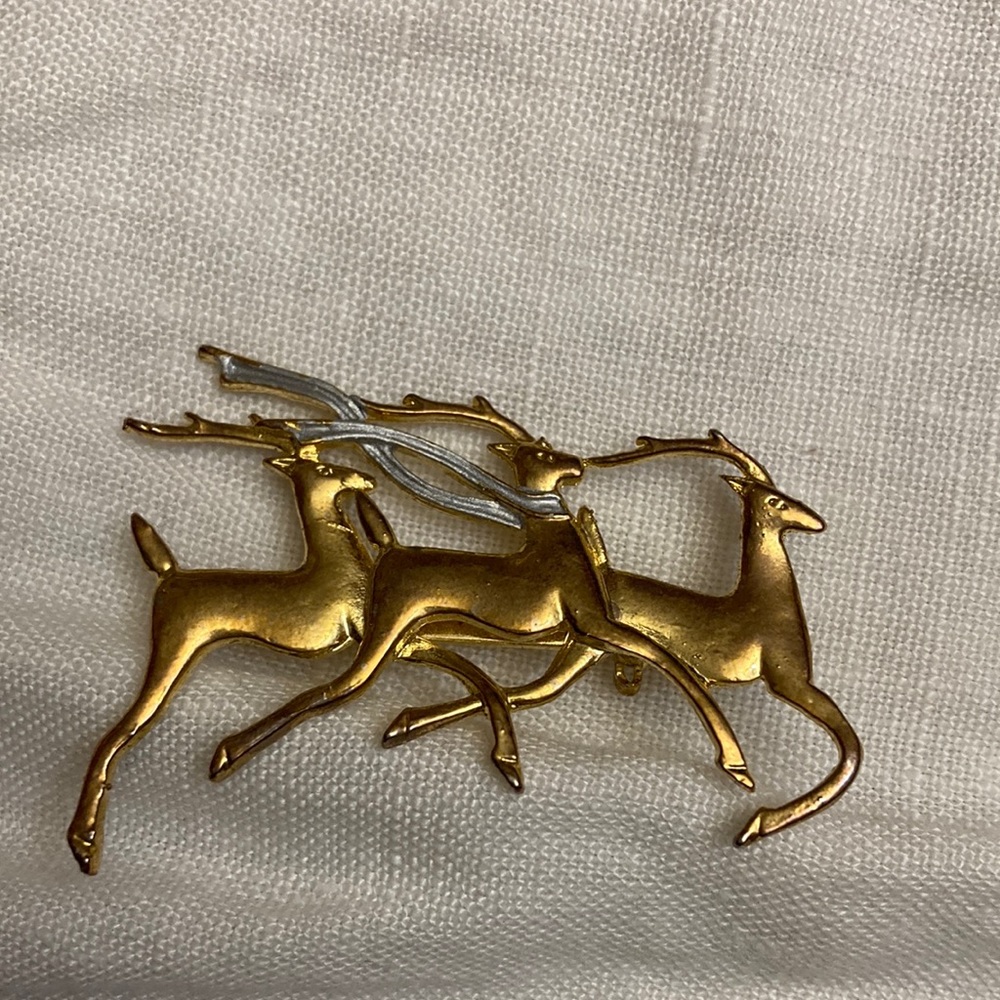Three reindeer gold plated brooch